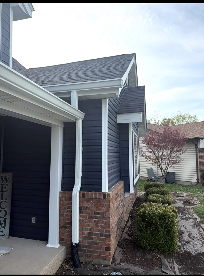 Dark residential siding and exterior trim