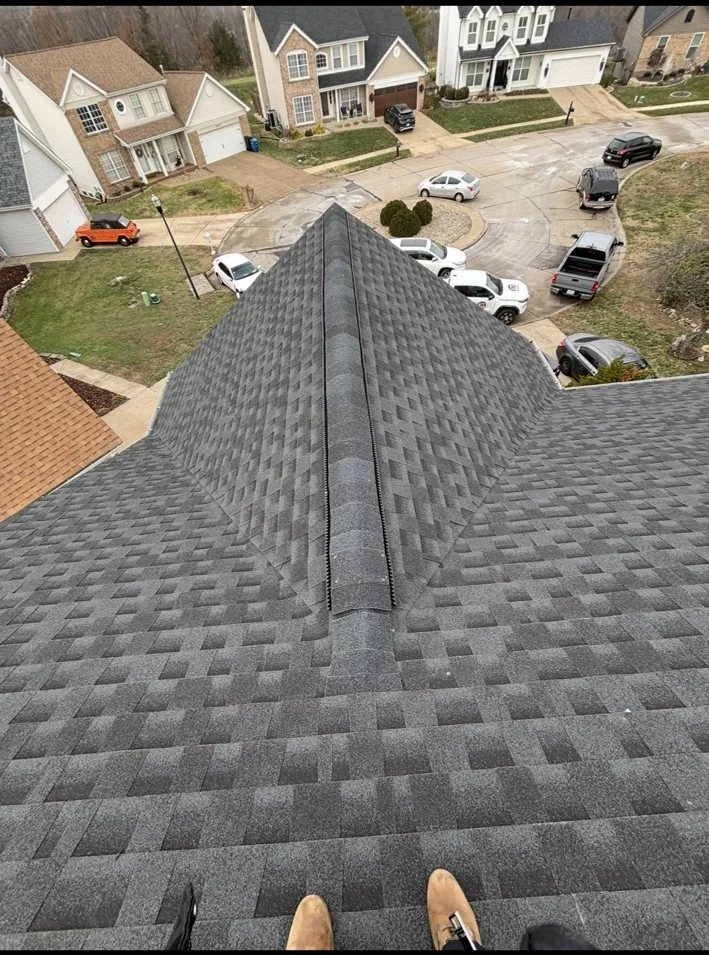 Completed shingle roofline from ridge
