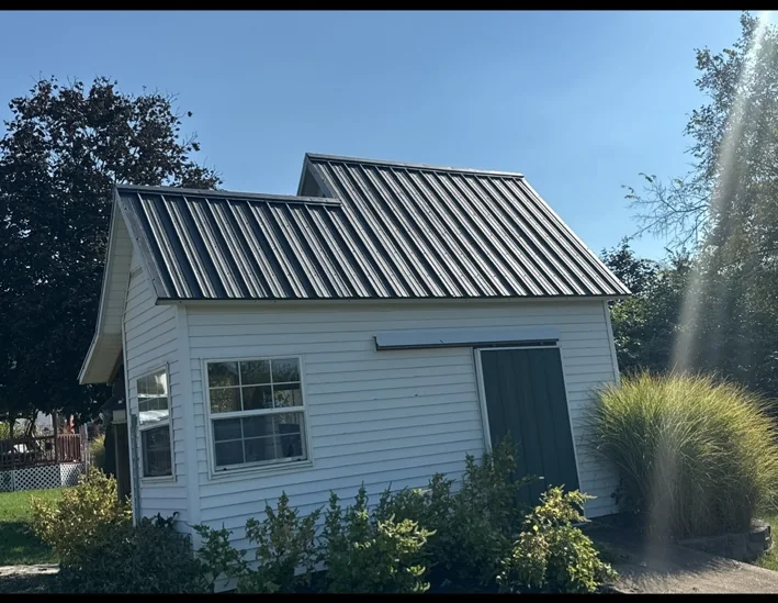 Standing-seam metal roof on a residential outbuilding