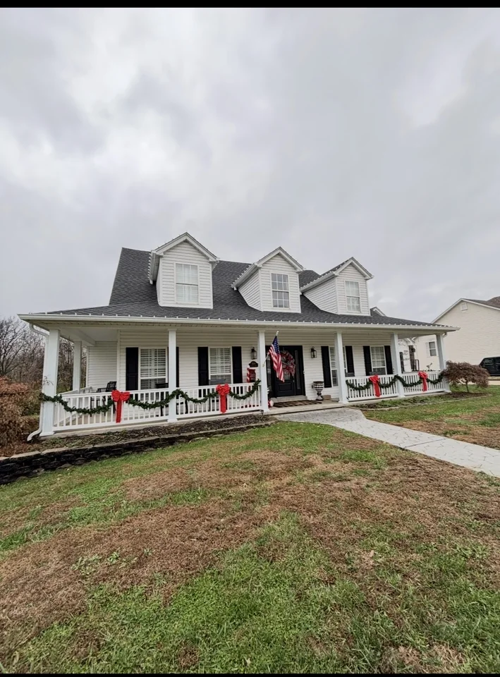 White home with porch and roof details