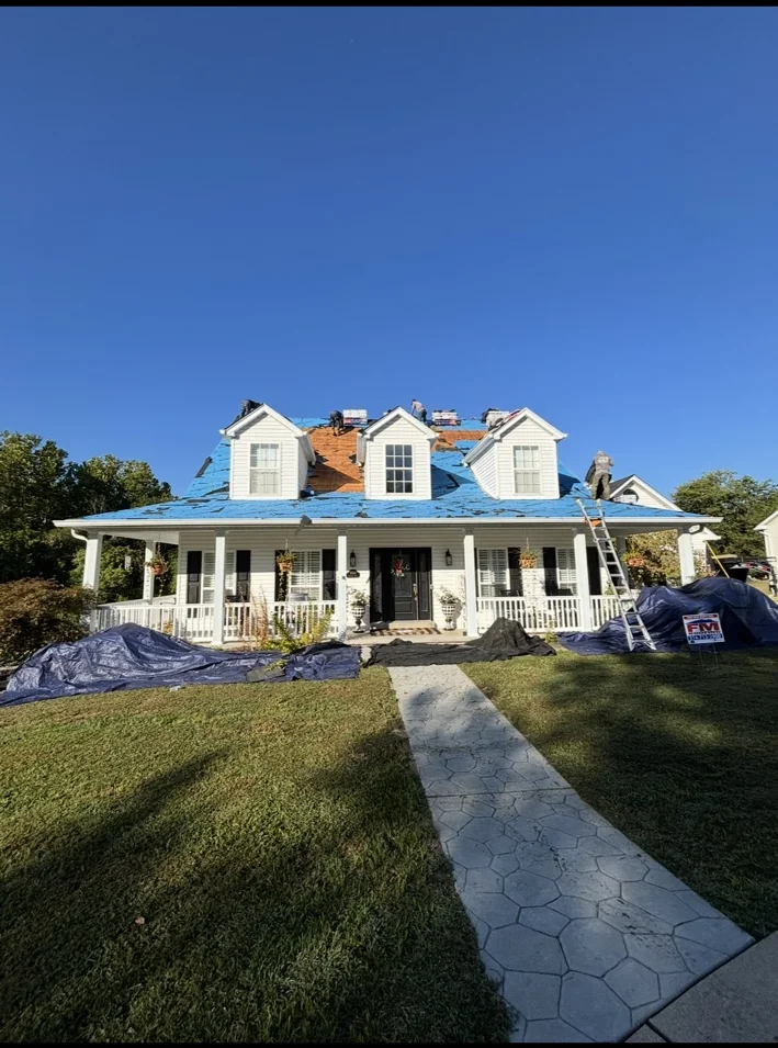 Residential roof work from the front lawn