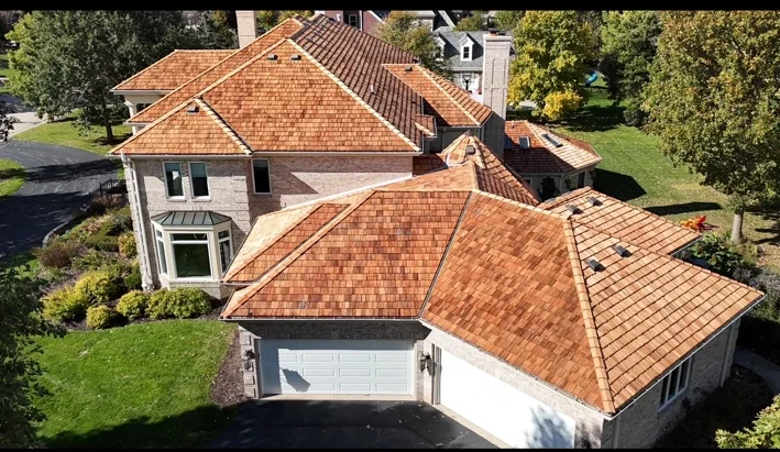 Street-facing aerial view of large multi-plane roof